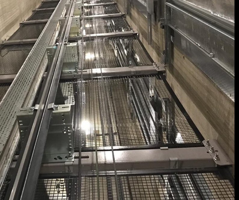 GOPELIA elevator support steel and rail brackets inside the 626 Flagler hoistway