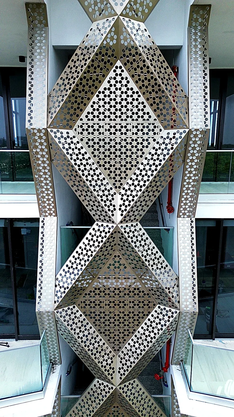 Perforated aluminum diamond-pattern screen detail - 756 84 St Residences, Miami Beach FL