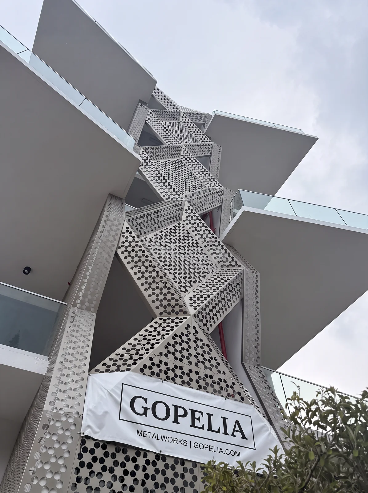 Perforated aluminum stair screen upward view - 756 84 St Residences, Miami Beach FL