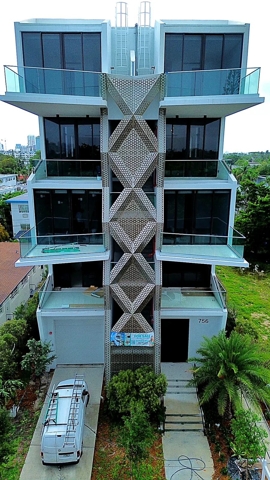 Full-height perforated aluminum stair screen - 756 84 St Residences, Miami Beach FL
