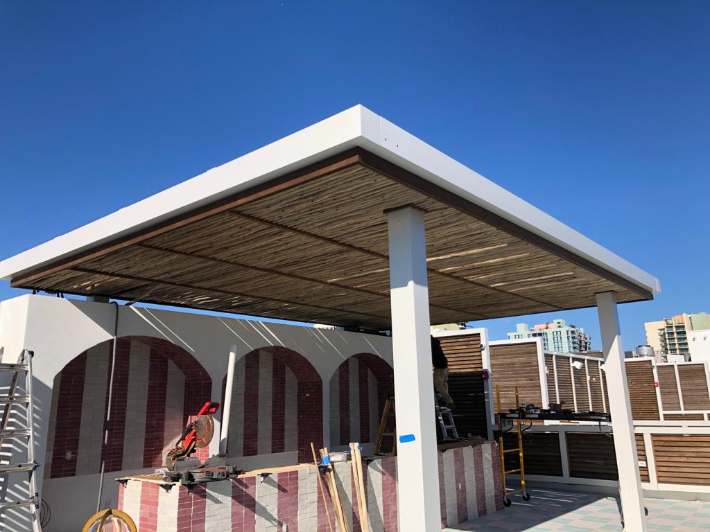 Full rooftop pergola with louver screens and bar area — Esme Hotel, Miami Beach FL