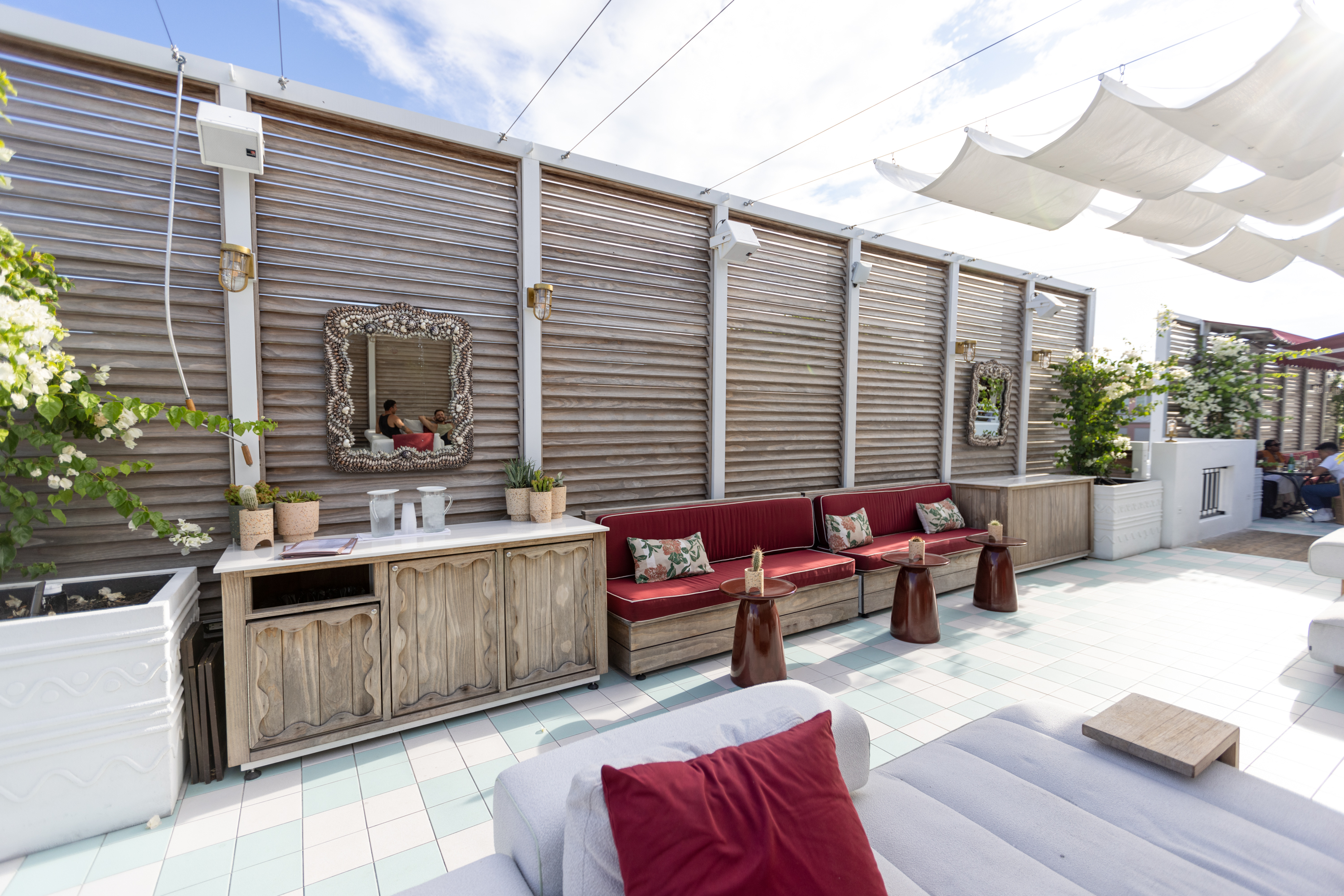Rooftop lounge with decorative louver screens and seating — Esme Hotel, Miami Beach FL