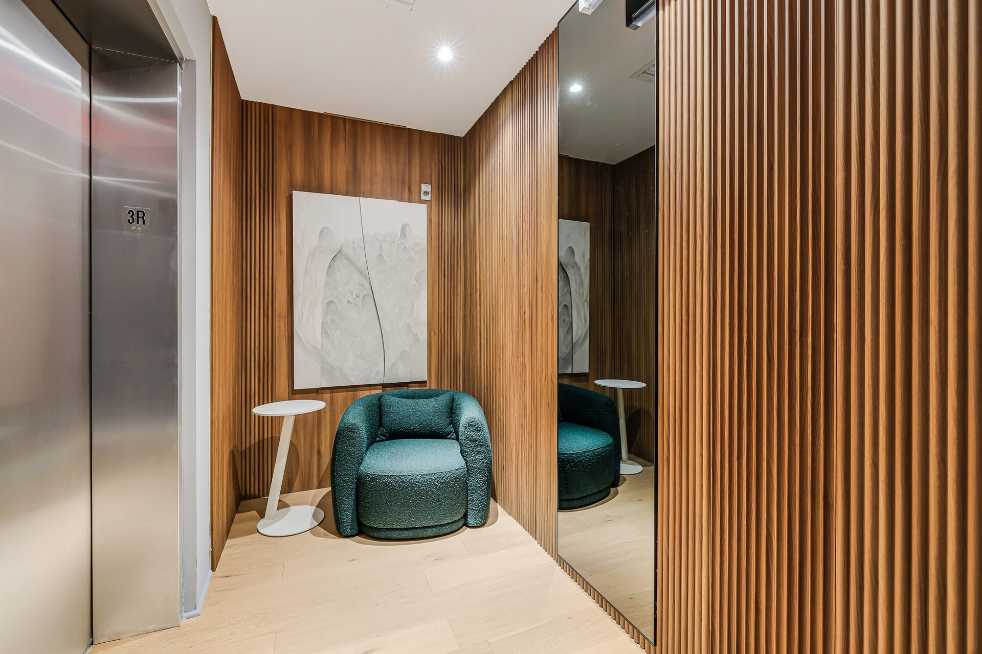 Elevator lobby with stainless steel finish - The March Hotel