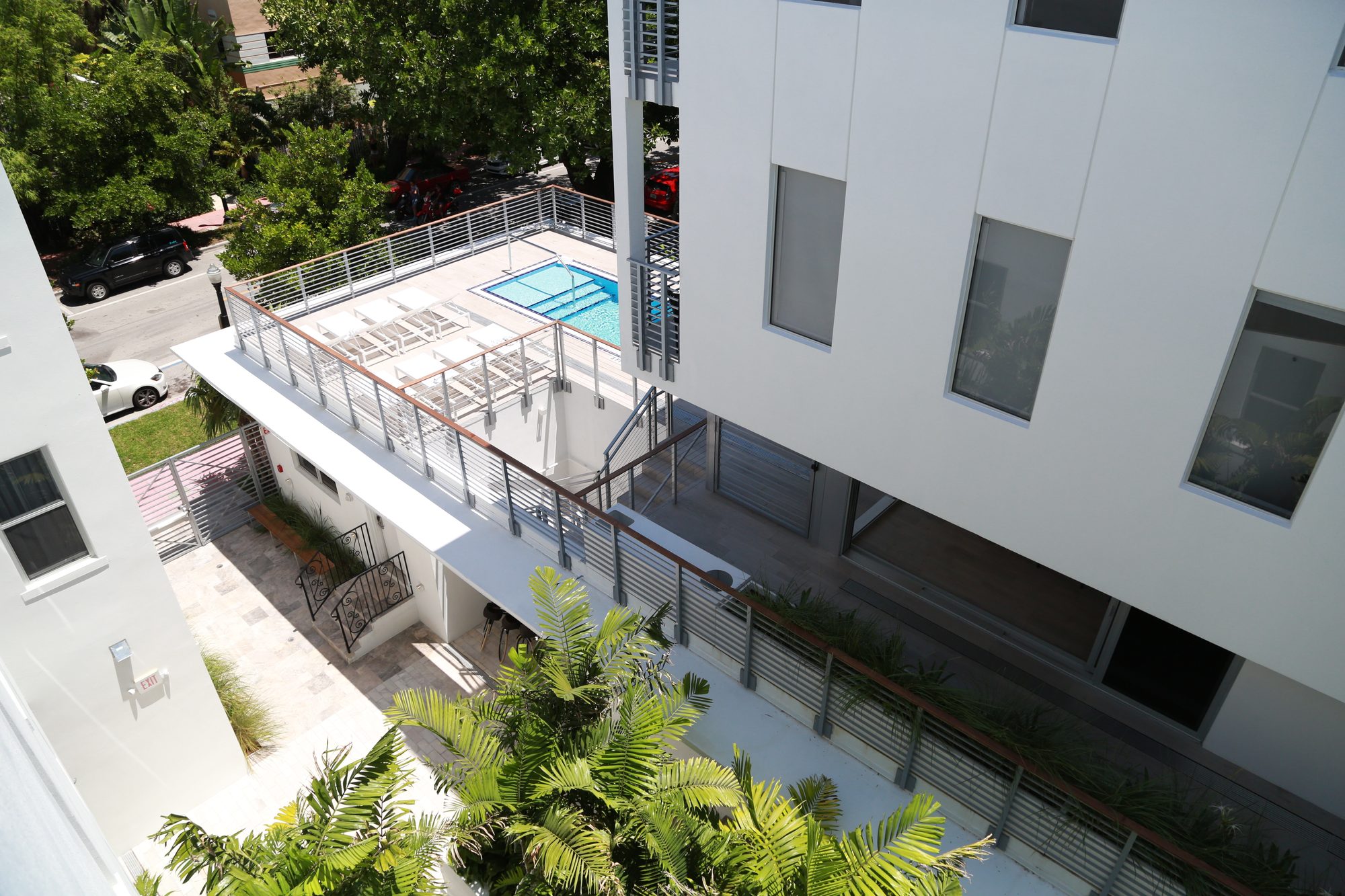 Courtyard aerial with pool deck railings and stairs - The Meridian Hotel, Miami Beach FL