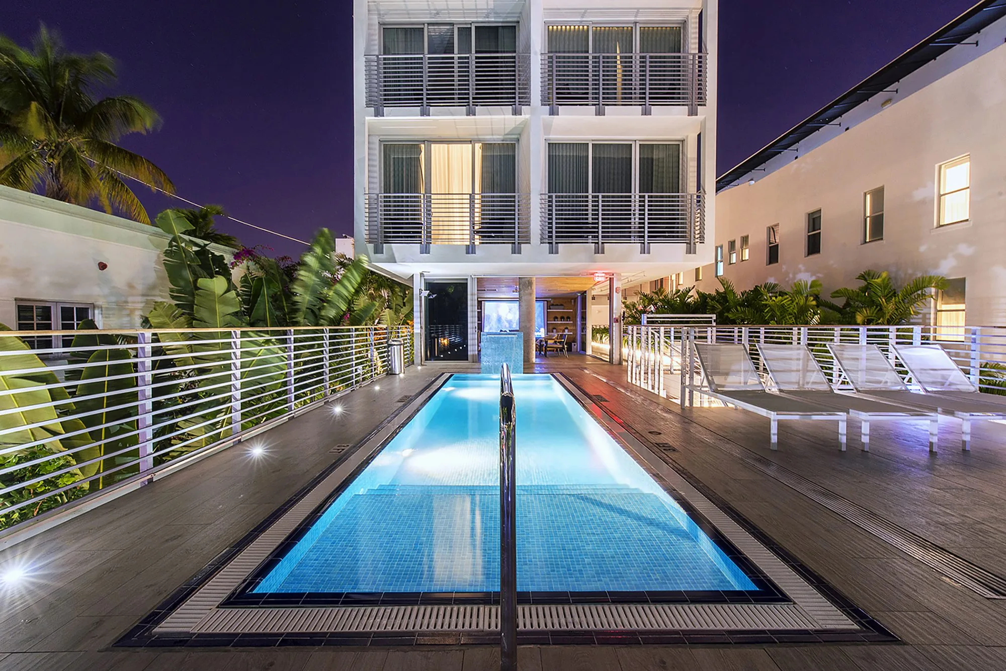 Night view of pool and aluminum railings - The Meridian Hotel, Miami Beach FL