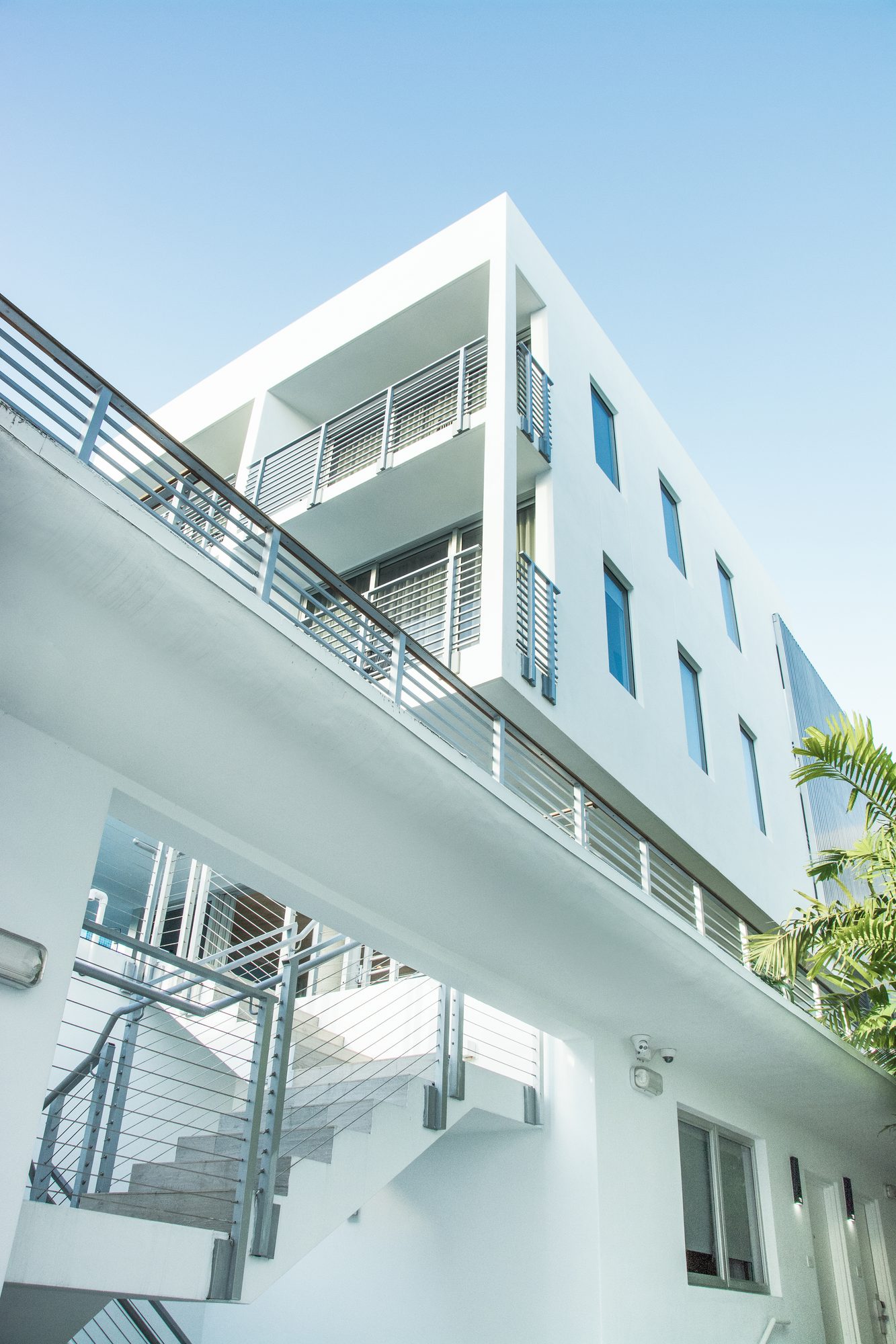 Exterior staircase with aluminum railings and louvers - The Meridian Hotel, Miami Beach FL