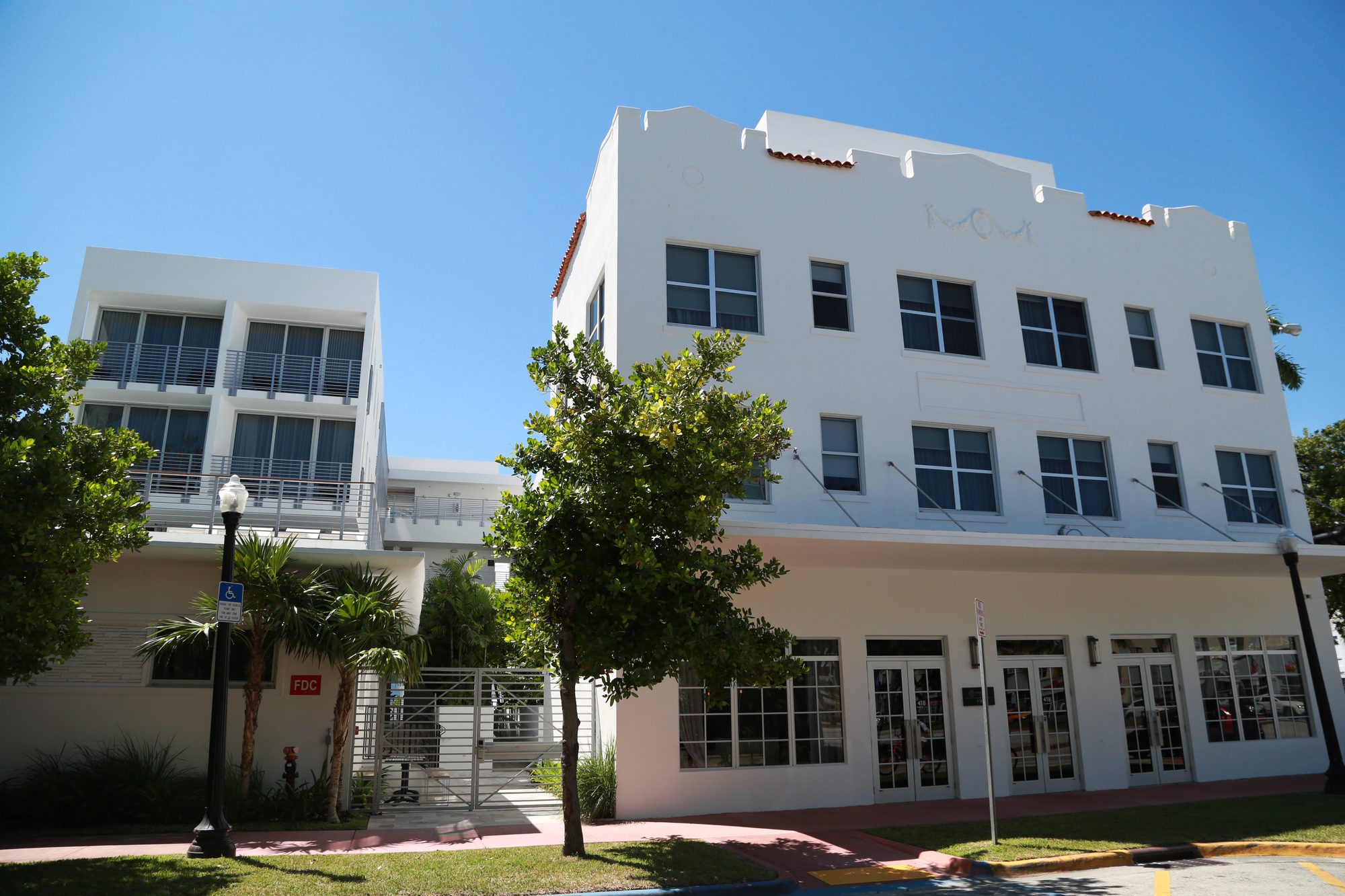 Street-level exterior with balcony railings and gates - The Meridian Hotel, Miami Beach FL