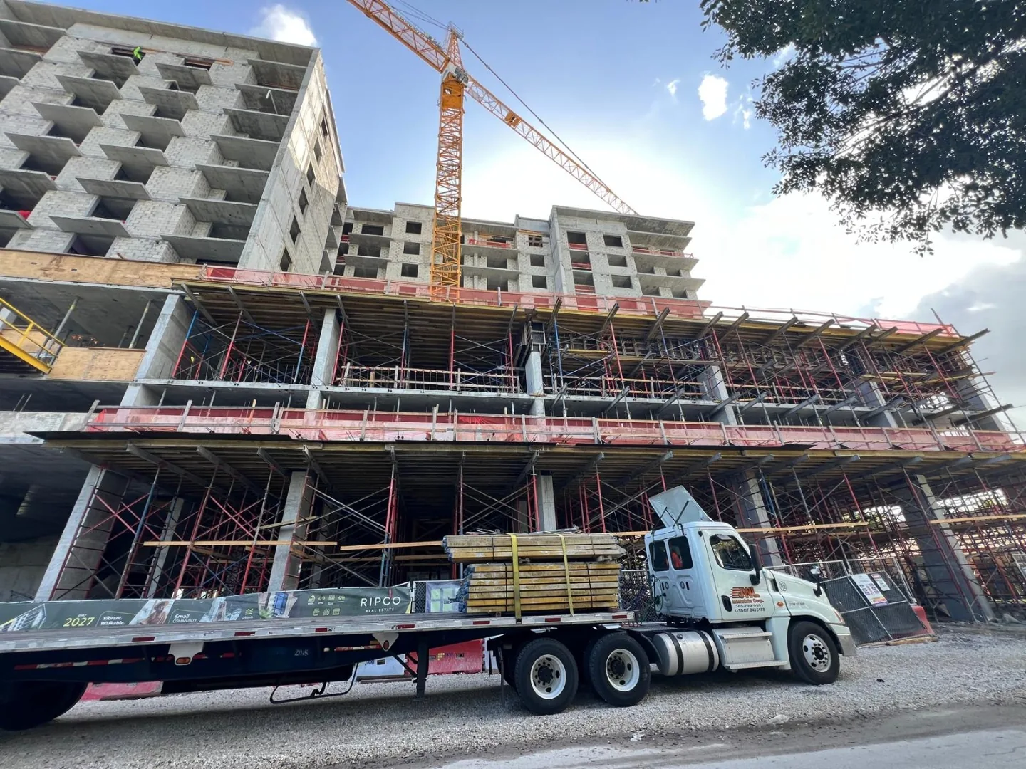 Structural progress with material delivery flatbed - Northside Town Station