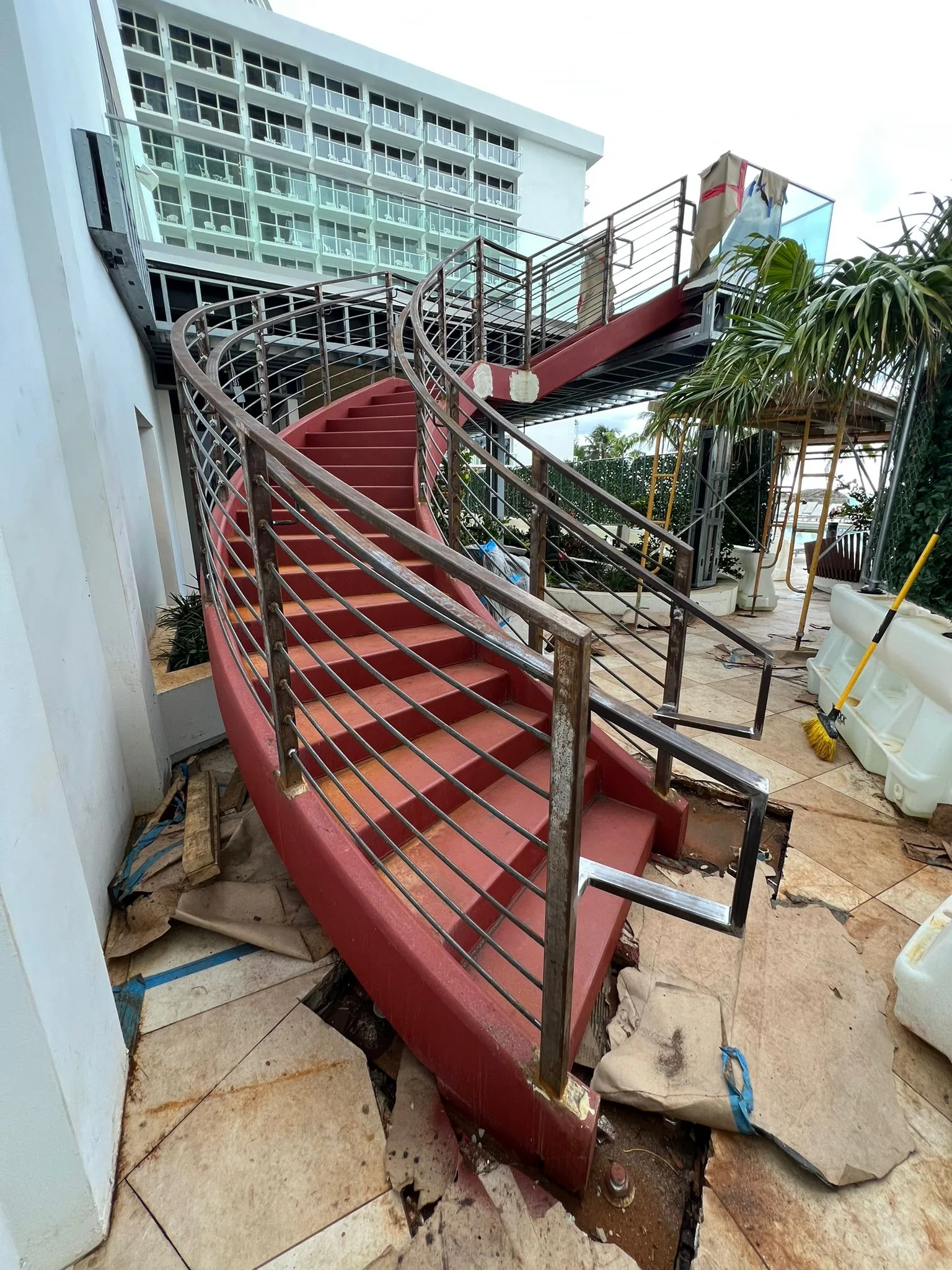 Spiral staircases, structural metal deck, and cable railings - Newport Beachside Resort gallery