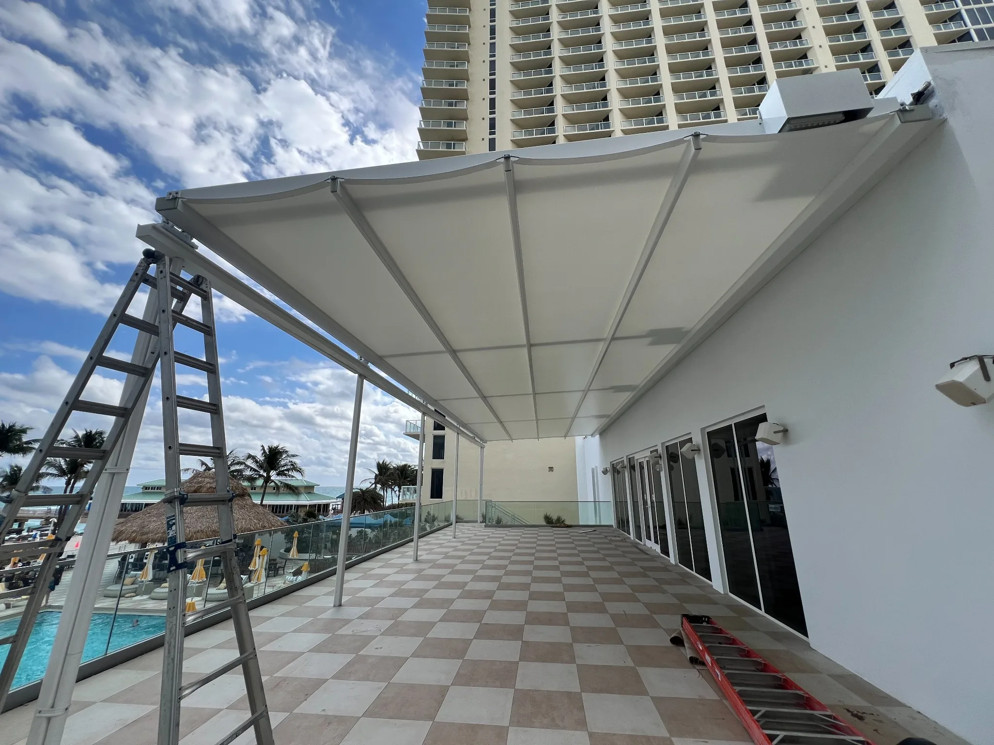 Spiral staircases, structural metal deck, and cable railings - Newport Beachside Resort gallery