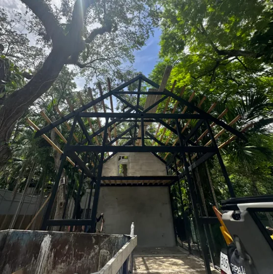 Custom carport structure with faux wood aluminum louvers - Jungle Book Residence, Miami FL