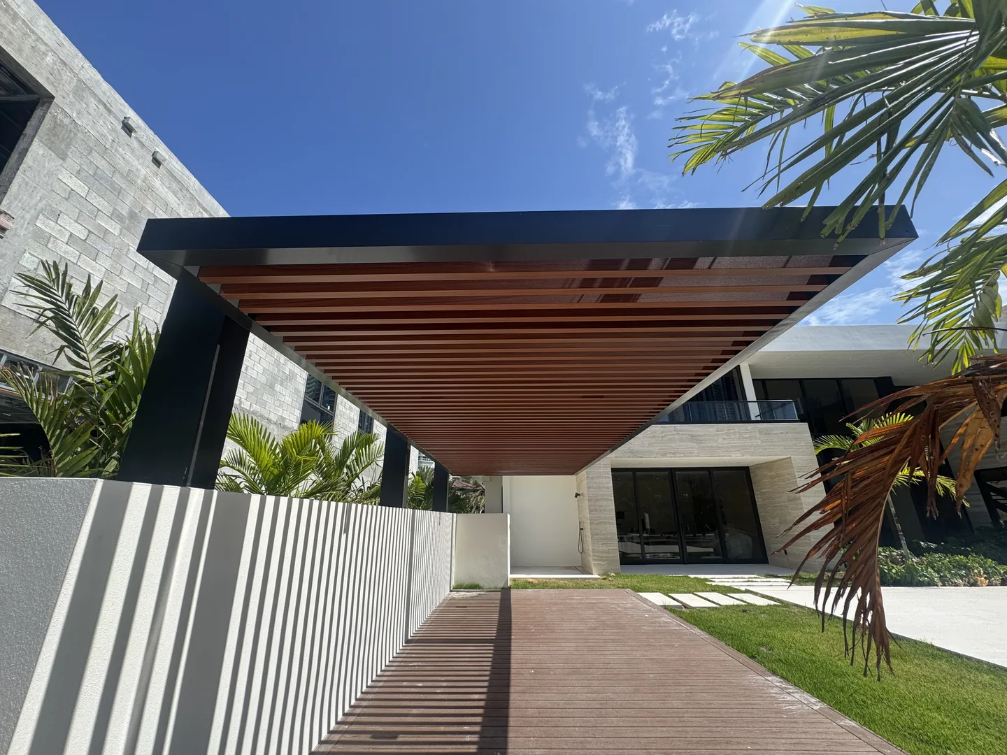 Cantilevered steel and faux-wood pergola over walkway - Atlantic Ave Residence gallery