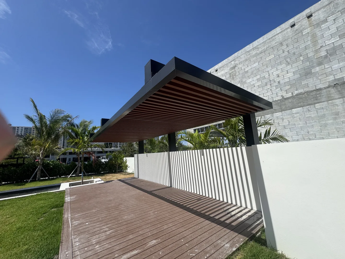 Aluminum picket privacy fence with cantilevered faux-wood canopy - Atlantic Ave Residence gallery